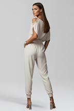 Damesjumpsuit – Damesjumpsuit met overslaghals en elastische taille – achteraanzicht | Pancreitis