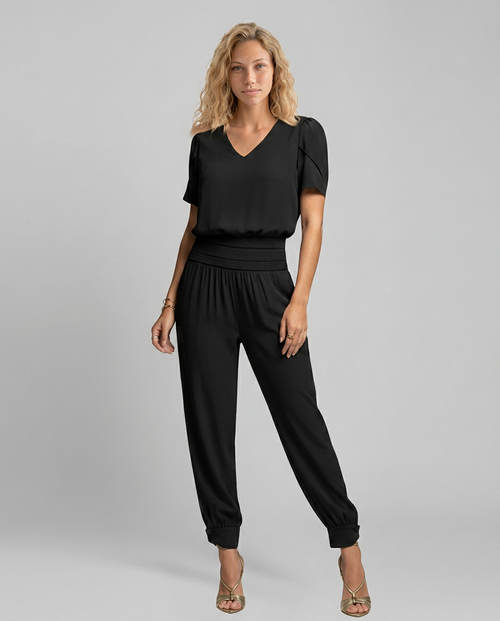 Erma V-Neck Jumpsuit met elastische taille in zwart, groen, blauw en geel.