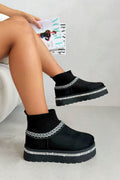 Sprankelende sok warmers mini snugg boots in zwart voor stijl en comfort.